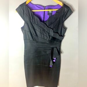 Black cocktail dress with purple accents. Size 8. Zip back. Like new condition.